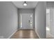 Inviting entryway with light flooring and a modern front door at 3950 Bozeman Way, Bargersville, IN 46106