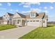 House exterior showcasing a front porch and landscaped yard at 3950 Bozeman Way, Bargersville, IN 46106