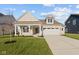 Two-story house with front porch, driveway and landscaping at 3950 Bozeman Way, Bargersville, IN 46106
