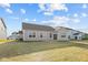 Tan house exterior with a backyard and neighboring houses at 3950 Bozeman Way, Bargersville, IN 46106