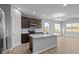 Modern kitchen with island, stainless steel appliances and hardwood floors at 3950 Bozeman Way, Bargersville, IN 46106
