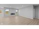 Bright living room featuring hardwood floors and a fireplace at 3950 Bozeman Way, Bargersville, IN 46106