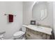 Charming half bathroom featuring a decorative mirror and custom vanity at 1038 White Oak Dr, Plainfield, IN 46168