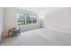 Spacious bedroom with large windows offering natural light, complemented by neutral carpet at 1038 White Oak Dr, Plainfield, IN 46168