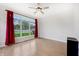 Bright bedroom with laminate floors, large windows, and bold curtains offering plenty of natural light at 1038 White Oak Dr, Plainfield, IN 46168
