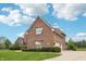 Beautiful brick home with well-maintained landscaping and a curved driveway entrance at 1038 White Oak Dr, Plainfield, IN 46168