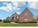 Charming brick two-story home boasts a beautiful lawn and inviting curb appeal at 1038 White Oak Dr, Plainfield, IN 46168
