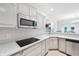 Bright kitchen with modern countertops and fixtures, stainless steel appliances, and a breakfast bar at 1038 White Oak Dr, Plainfield, IN 46168