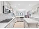 Modern kitchen with stainless steel appliances, granite countertops, a kitchen island, and wood flooring at 1038 White Oak Dr, Plainfield, IN 46168