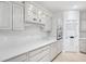 Bright kitchen featuring modern cabinetry, sleek countertops, stainless steel appliances, and wood flooring at 1038 White Oak Dr, Plainfield, IN 46168