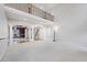 Open-concept living space with soaring ceilings, elegant columns, and plush carpeting at 1038 White Oak Dr, Plainfield, IN 46168