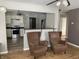 Open-concept living room featuring hardwood floors, recessed lighting, and seating area adjacent to kitchen at 2104 N Ball Ave, Muncie, IN 47304