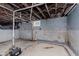 Unfinished basement ready to be designed with concrete floors and painted walls at 625 N Grant Ave, Indianapolis, IN 46201