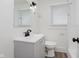 Updated bathroom with a stylish vanity, black faucet, and modern lighting at 625 N Grant Ave, Indianapolis, IN 46201
