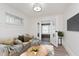 Cozy living room with comfortable seating, a large window, and stylish décor at 625 N Grant Ave, Indianapolis, IN 46201