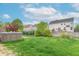Spacious backyard with lush green lawn and hot tub at 14446 Chapelwood Ln, Fishers, IN 46037