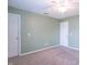 Carpeted bedroom with ceiling fan, multiple closets and outlets at 14446 Chapelwood Ln, Fishers, IN 46037