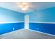Bedroom featuring two-tone blue walls, a ceiling fan, carpeted flooring, and a charming wall quote at 14446 Chapelwood Ln, Fishers, IN 46037