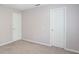 Bedroom with neutral paint, carpeted floor, and white doors at 14446 Chapelwood Ln, Fishers, IN 46037
