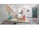 Bright open entryway with staircase and office space featuring wood floors and view to living spaces at 14446 Chapelwood Ln, Fishers, IN 46037