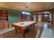 Basement game room featuring a pool table, built-in shelving, and updated lighting at 14446 Chapelwood Ln, Fishers, IN 46037