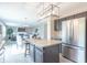Bright kitchen with stainless appliances, large granite island and access to the living room at 14446 Chapelwood Ln, Fishers, IN 46037