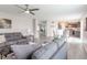 Bright open-concept living room and dining area with modern furniture, wood floors and lots of light at 14446 Chapelwood Ln, Fishers, IN 46037