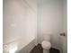 Bright bathroom featuring a shower-tub combination and a modern toilet at 1573 Hanover St, Danville, IN 46122