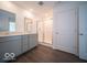 Well-lit bathroom featuring a double sink vanity with stylish mirrors and a walk-in shower at 1573 Hanover St, Danville, IN 46122