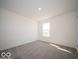 An inviting bedroom featuring neutral carpeting and bright natural light at 1573 Hanover St, Danville, IN 46122