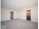 Spacious bedroom with plush neutral carpet and an ensuite bathroom showcasing double sinks at 1573 Hanover St, Danville, IN 46122