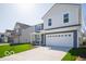 Two-story home with a two-car garage and a lush green lawn at 1573 Hanover St, Danville, IN 46122