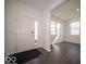 Bright foyer featuring luxury vinyl plank flooring and a view into the living room at 1573 Hanover St, Danville, IN 46122