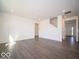 Bright living room features modern flooring and neutral walls creating a welcoming and versatile space at 1573 Hanover St, Danville, IN 46122