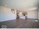 Open living area featuring luxury vinyl plank flooring and a modern kitchen at 1573 Hanover St, Danville, IN 46122