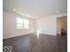 Bright and spacious living room with luxury vinyl plank flooring and recessed lighting at 1573 Hanover St, Danville, IN 46122