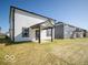 Spacious backyard with a patio and modern home exterior at 1579 Hanover St, Danville, IN 46122