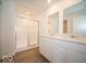 Elegant bathroom with a double vanity, chrome faucets, and a sleek glass-enclosed shower at 1579 Hanover St, Danville, IN 46122