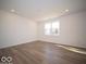 Spacious bedroom with hardwood floors, white walls, a window, and recessed lighting at 1579 Hanover St, Danville, IN 46122