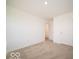 Comfortable carpeted bedroom with neutral walls and nearby doorway at 1579 Hanover St, Danville, IN 46122
