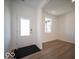 Bright entryway with hardwood flooring, white walls, a window, and a clear view of the front door at 1579 Hanover St, Danville, IN 46122