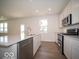 Bright and modern kitchen with island and stainless steel appliances at 1579 Hanover St, Danville, IN 46122
