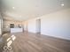 Open-concept living area flows into a modern kitchen with stainless steel appliances at 1579 Hanover St, Danville, IN 46122