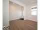 Open-concept living room featuring hardwood floors, white walls, a window, and a clear view of the entryway at 1579 Hanover St, Danville, IN 46122