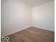 Empty living room with hardwood floors and white walls, offering a blank canvas for customization and decor at 1579 Hanover St, Danville, IN 46122