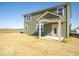 Backyard with olive siding and a covered porch at 1585 Hanover St, Danville, IN 46122