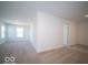 Carpeted bedroom featuring two large windows and ample natural light at 1585 Hanover St, Danville, IN 46122
