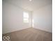 Sunny bedroom with carpet flooring and natural light, ideal for a restful retreat at 1585 Hanover St, Danville, IN 46122