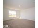 Bright bedroom with large windows, neutral carpet, and ample natural light at 1585 Hanover St, Danville, IN 46122