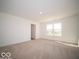 Bedroom featuring a window and neutral carpet at 1585 Hanover St, Danville, IN 46122